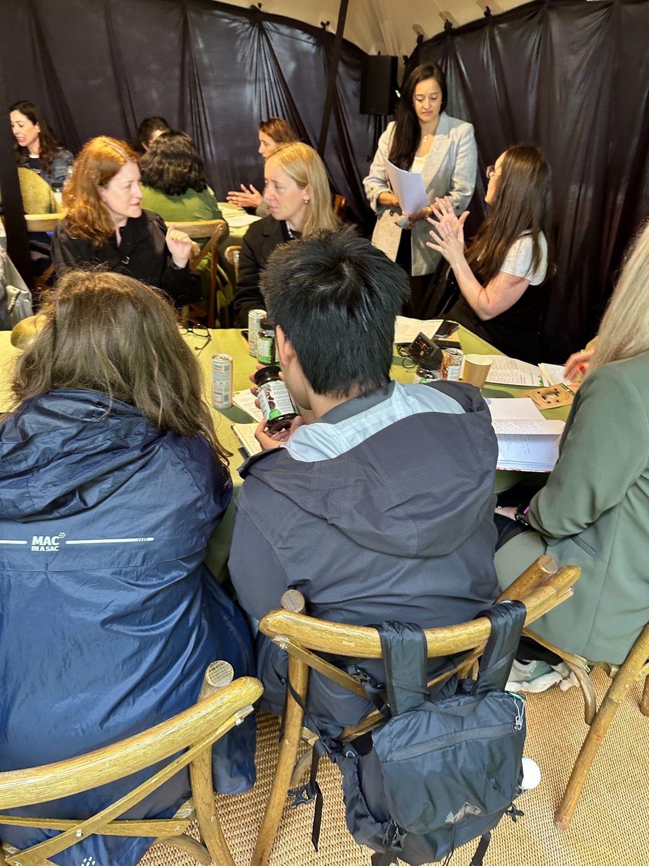 Writers at the London Writers Salon focus session with Grass & Co. drinks on the table